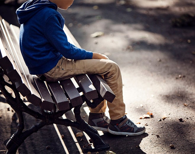 Boy Sitting on bench